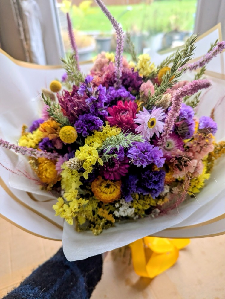 A purple and yellow dried-flower bouquet