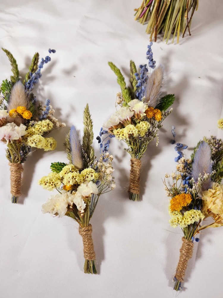 Dried-flower buttonholes wrapped in twine